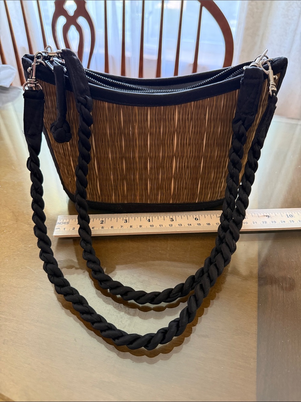 Summer purse in green and black with two braided handles very good condition